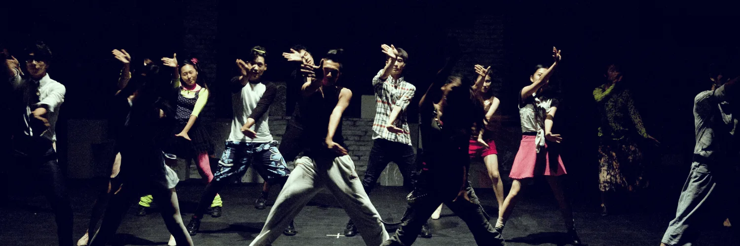 Dance company performing on stage